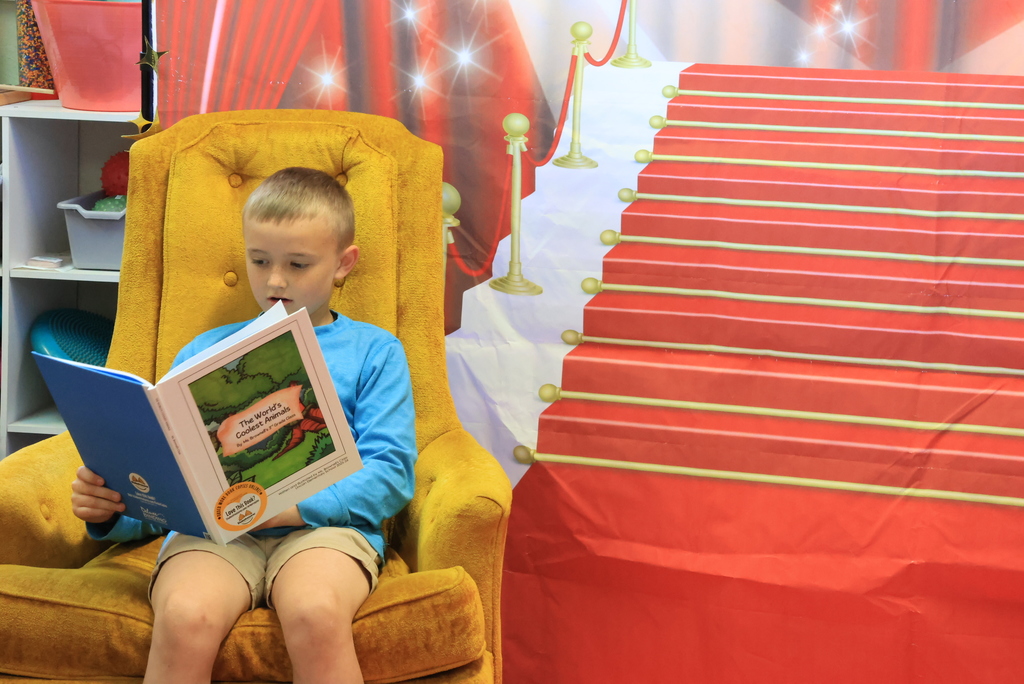 A student reads from the class book.