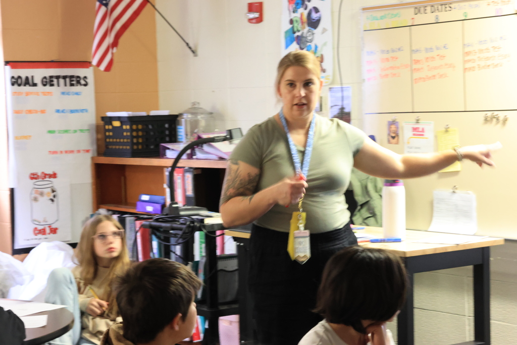 Mrs. Crabtree writes ideas about facing fear on the board as students give their suggestions.