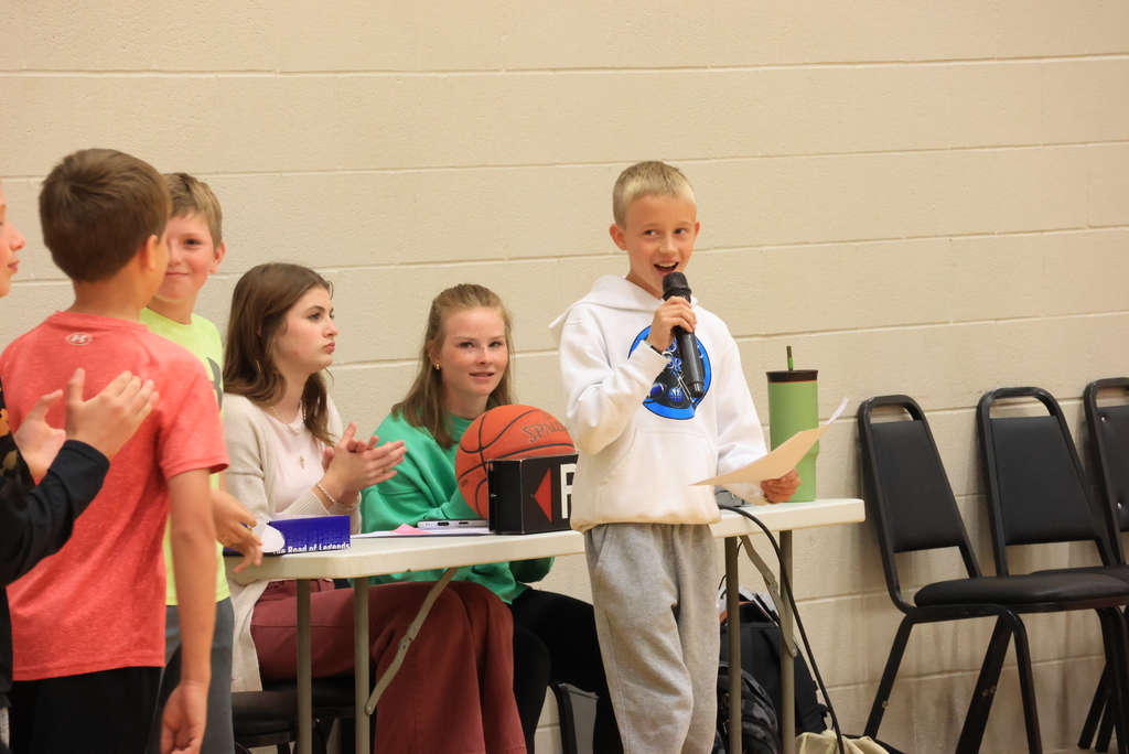 An announcer introduces students at the Garfield vs. CCCHS Student Council basketball game.