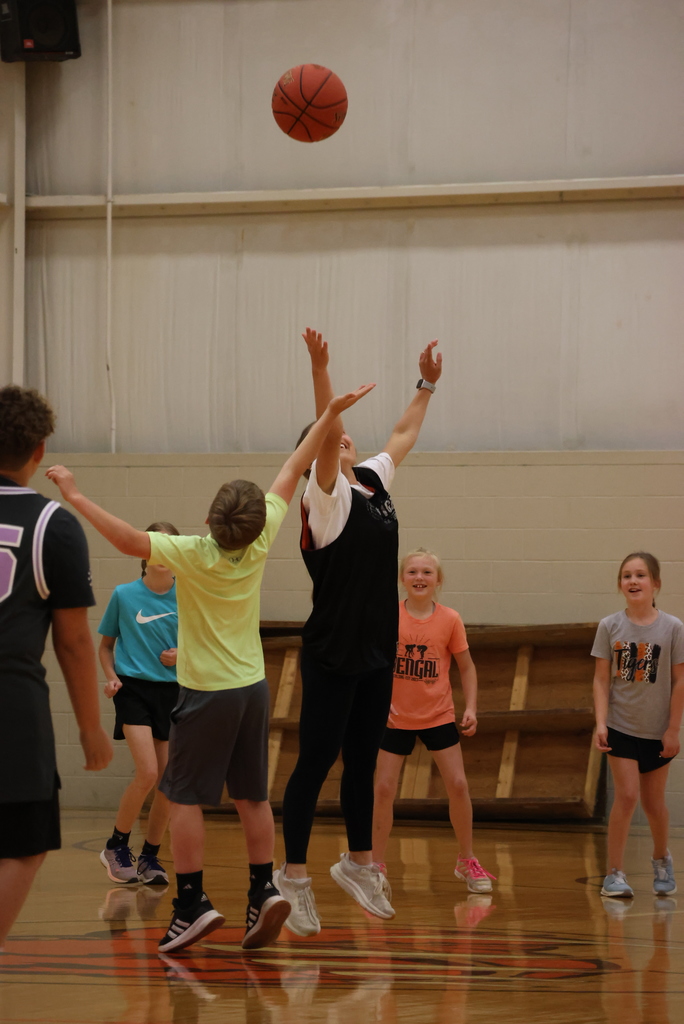A jump ball occurs at the start of the Garfield vs. CCCHS Student Council basketball game.