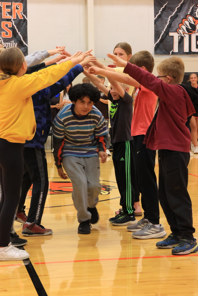 Students are introduced  and run through a human tunnel at the Garfield vs. CCCHS Student Council basketball game.