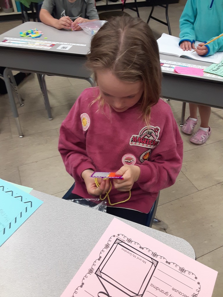 Members of Mrs. Carr's class work on their sewing canvas creations, which they have been working on as part of their soft start mornings.
