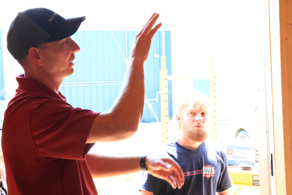 McCownGordon Regional Field Craft Manager Josh Ricketts reviews the nearly completed shed that Mr. Couch's students have been working on for the past couple of months.