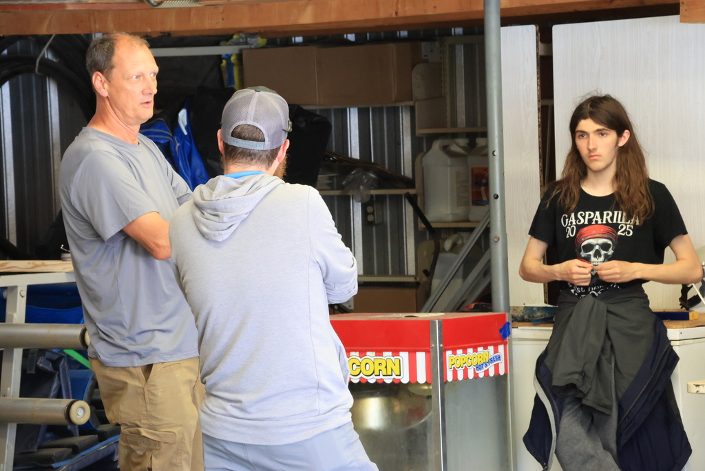Mr. Couch talks to his students after they reviewed the shed.