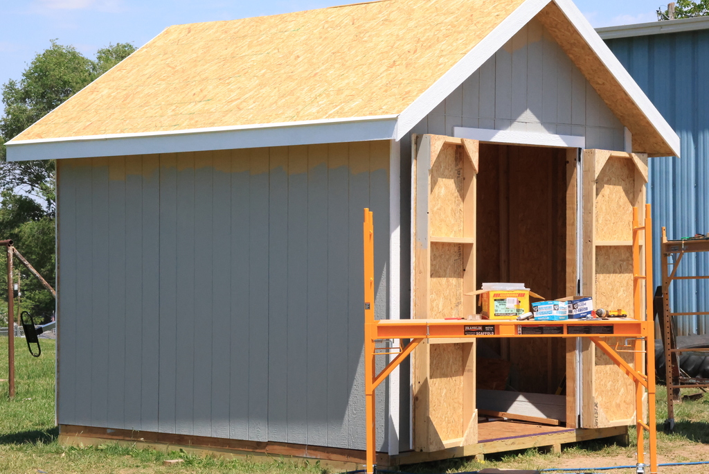 This is a photo of the nearly completed shed that Mr. Couch's students have been working on.