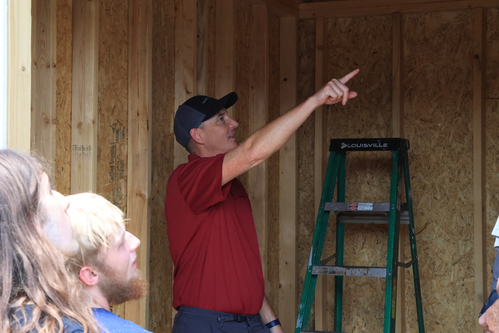 McCownGordon Regional Field Craft Manager Josh Ricketts reviews the nearly completed shed that Mr. Couch's students have been working on for the past couple of months.
