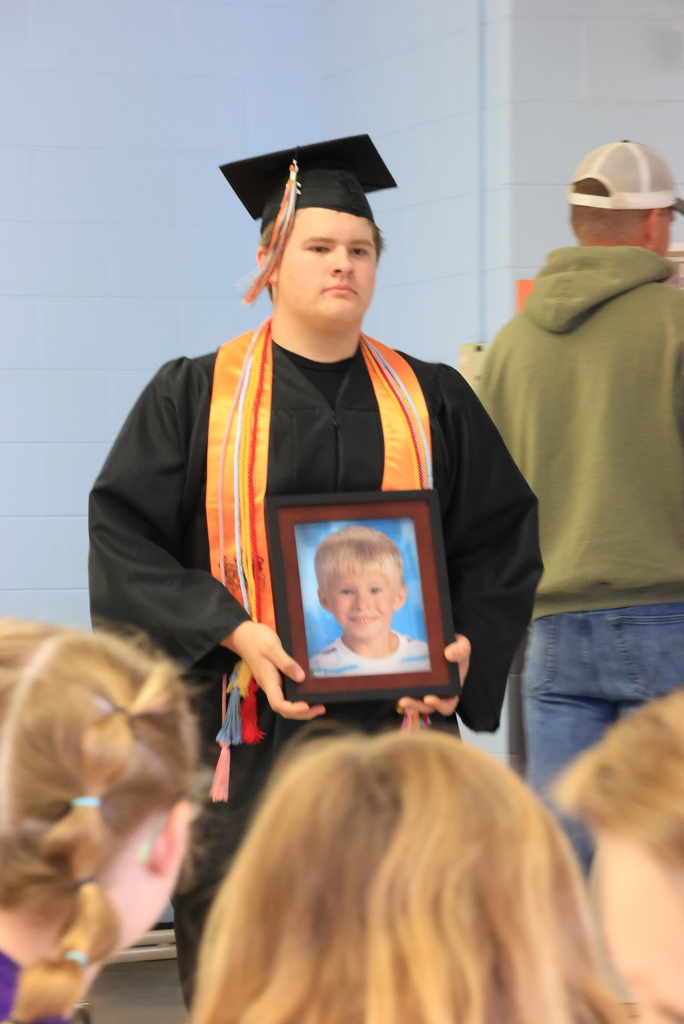 A senior walks the halls during the LES Graduation Walk.