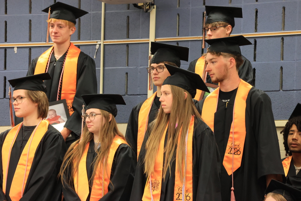 CCCHS seniors stand to be recognized during the LES Graduation Walk ceremony.