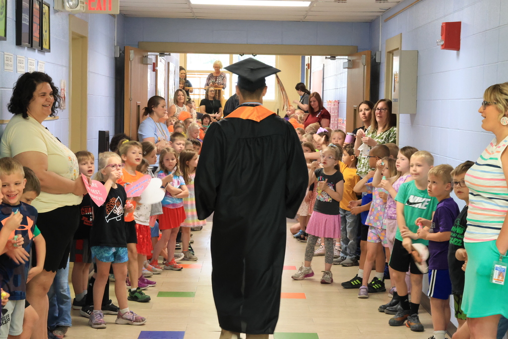 A senior walks the halls during the LES Graduation Walk.