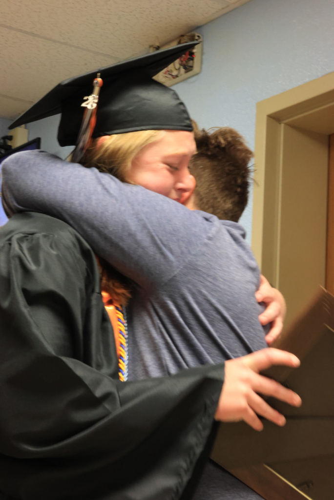 A CCCHS senior hugs her mom during the LES Graduation Walk.