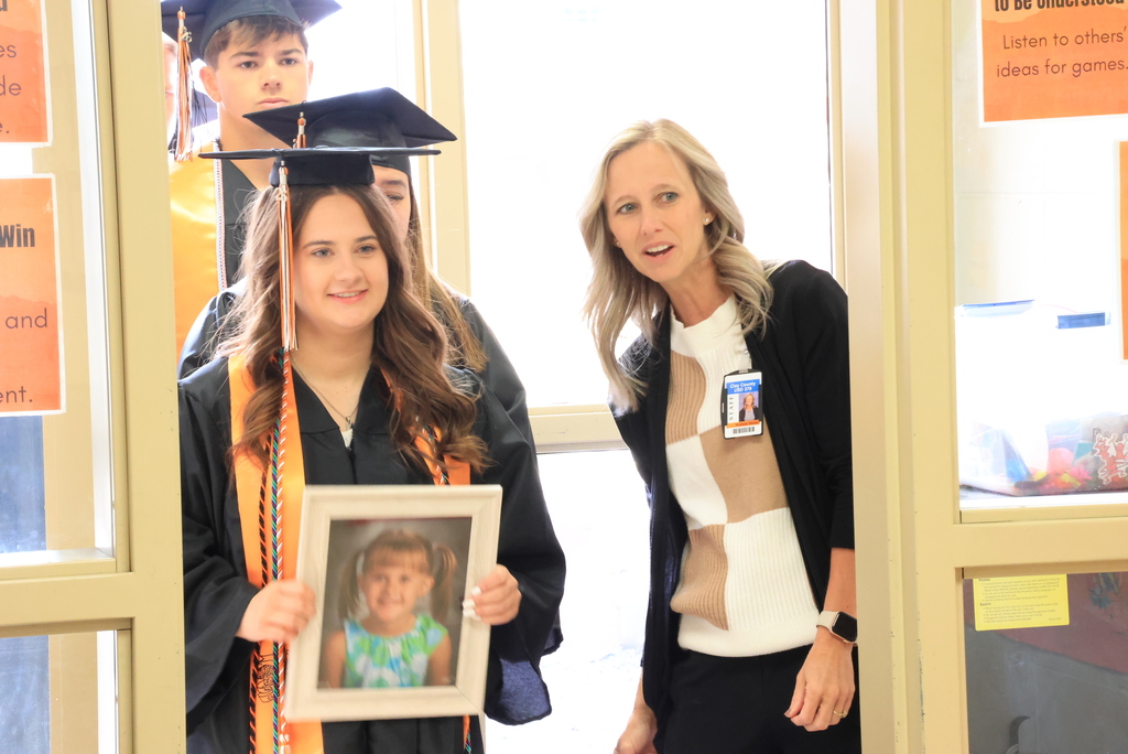 Seniors get directions from Mrs. Weller during the LES Graduation Walk.