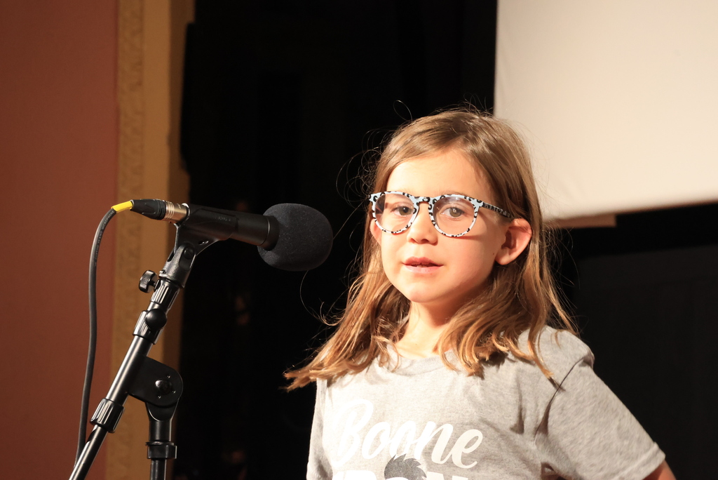 A student reads her poem during the "Popcorn and Poetry" event, which was held at the Rex Theatre.