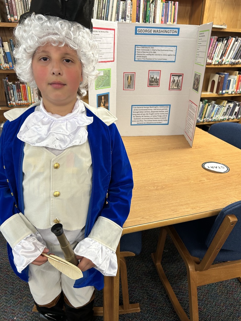 A student shows off his American Revolutionary War Hero Wax Museum character, where they dressed as American colonists and presented how their character contributed to the American Revolution.