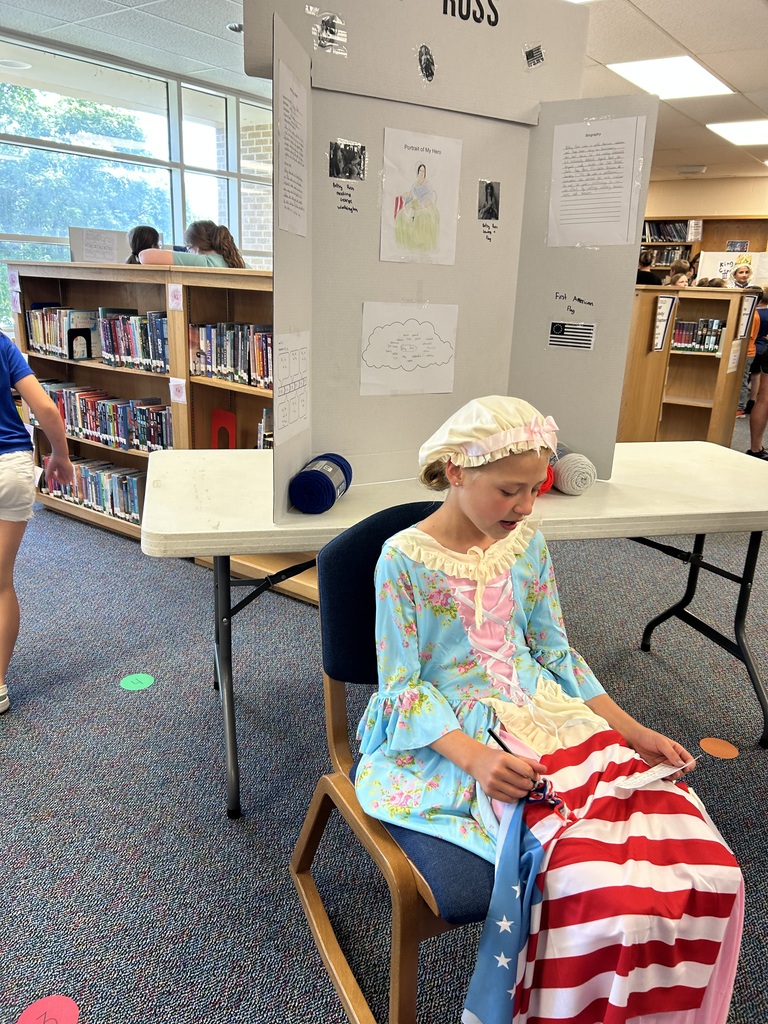 A student shows off her American Revolutionary War Hero Wax Museum character, where they dressed as American colonists and presented how their character contributed to the American Revolution.