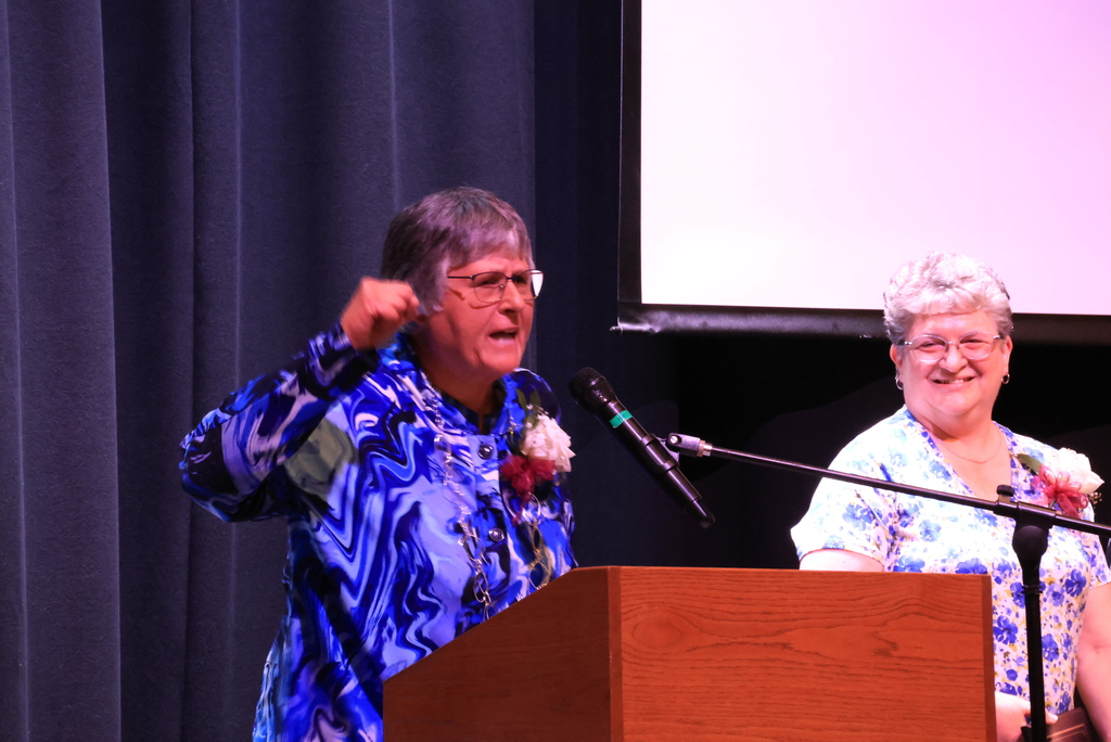 Long-time Hiistory and Government teacher Laura Pollman addresses the audience at the Expect Success ceremony.