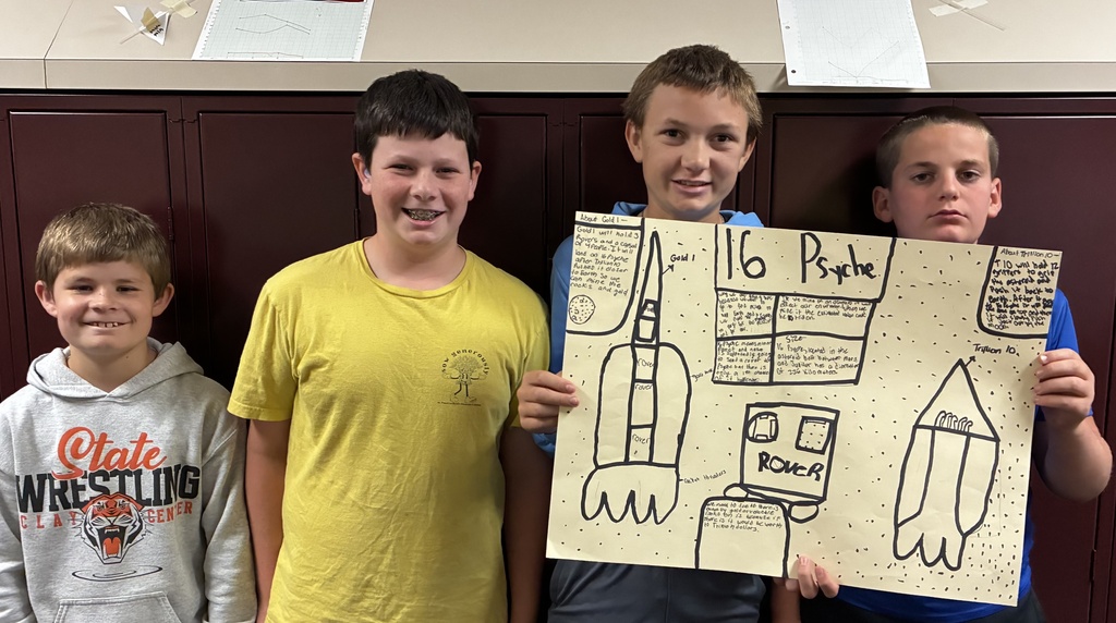 Mr. Walsh's 6th grade science students show off their space mission research project.