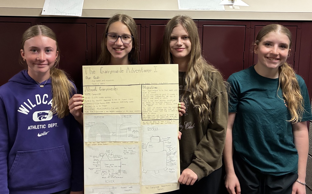 Mr. Walsh's 6th grade science students show off their space mission research project.