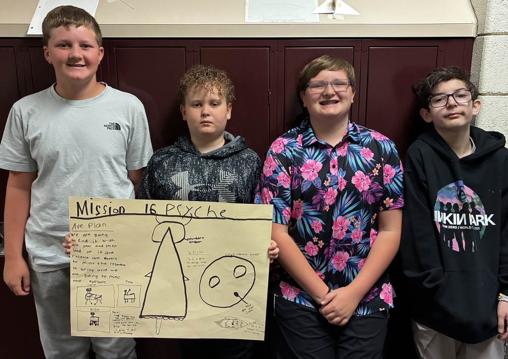 Mr. Walsh's 6th grade science students show off their space mission research project.