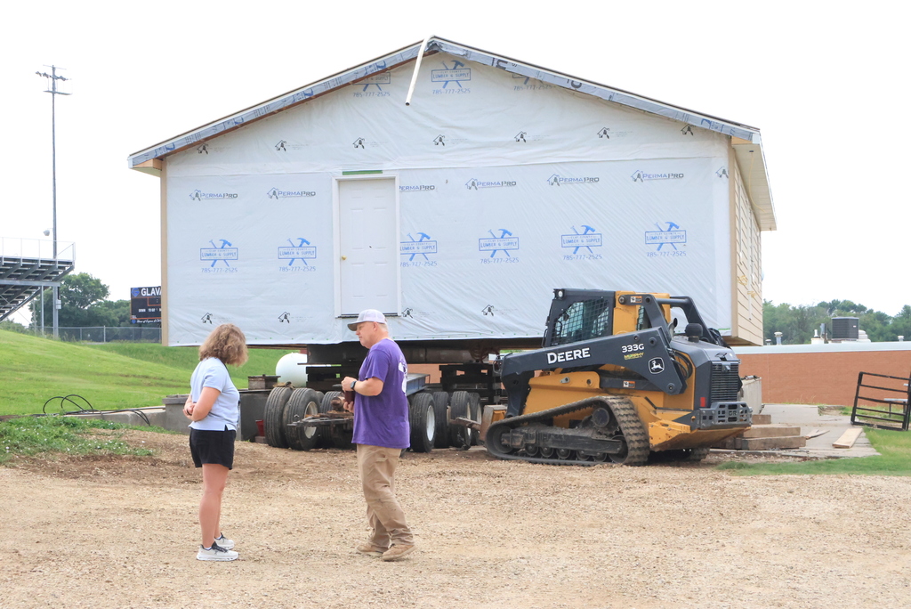 These are photos of the 2026 CCCHS Tiger House making its way through town and onto its permanent resting place at 725 Lane Street.