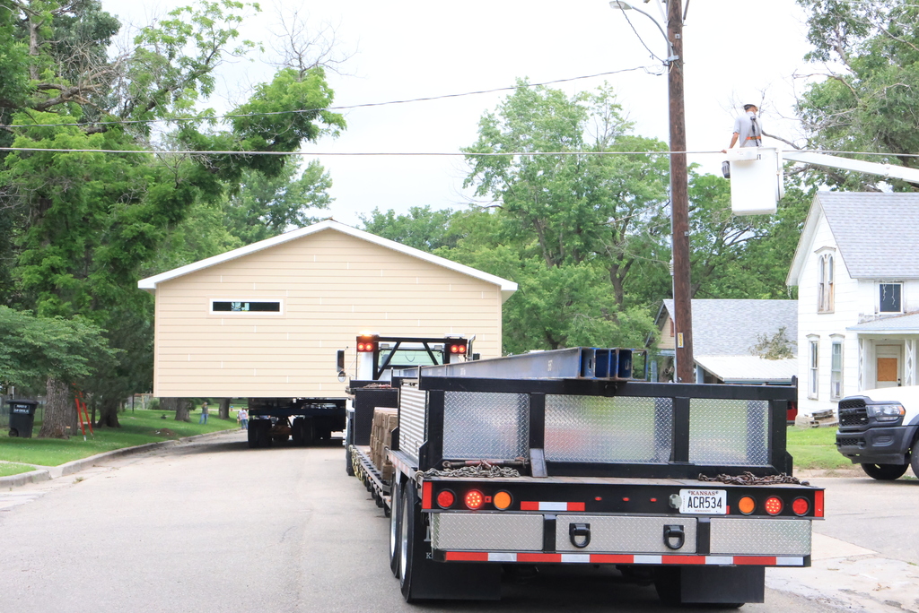 These are photos of the 2026 CCCHS Tiger House making its way through town and onto its permanent resting place at 725 Lane Street.