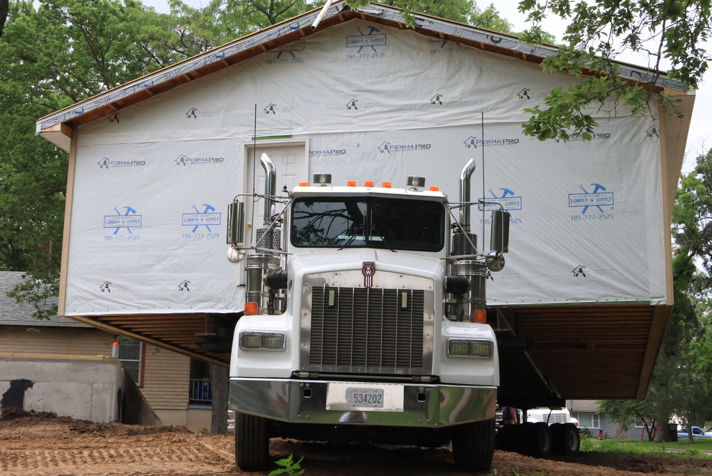 These are photos of the 2026 CCCHS Tiger House making its way through town and onto its permanent resting place at 725 Lane Street.