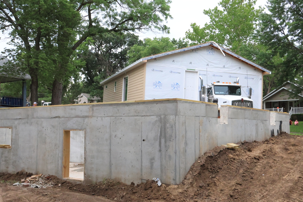These are photos of the 2026 CCCHS Tiger House making its way through town and onto its permanent resting place at 725 Lane Street.