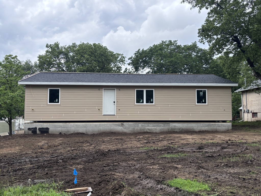 These are photos of the 2026 CCCHS Tiger House making its way through town and onto its permanent resting place at 725 Lane Street.