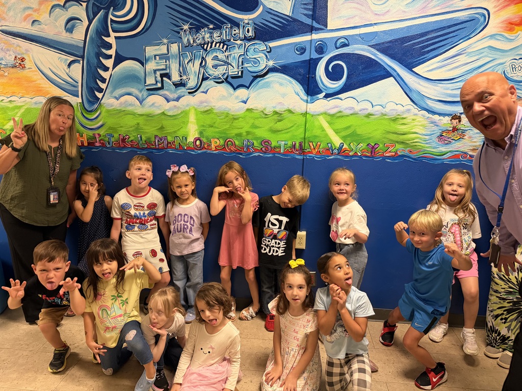 New principal Mr. Leis jumps into a photo of the K/1 class.