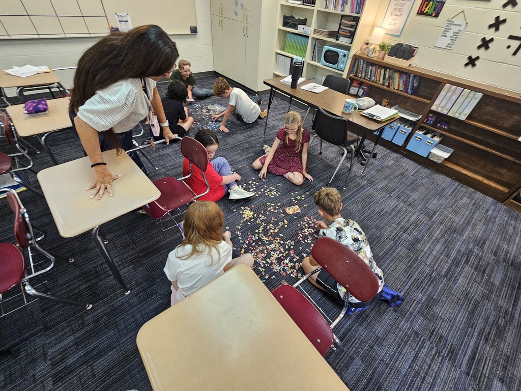 Mrs. Bybee's math classes learn about teamwork by building puzzles in small groups.