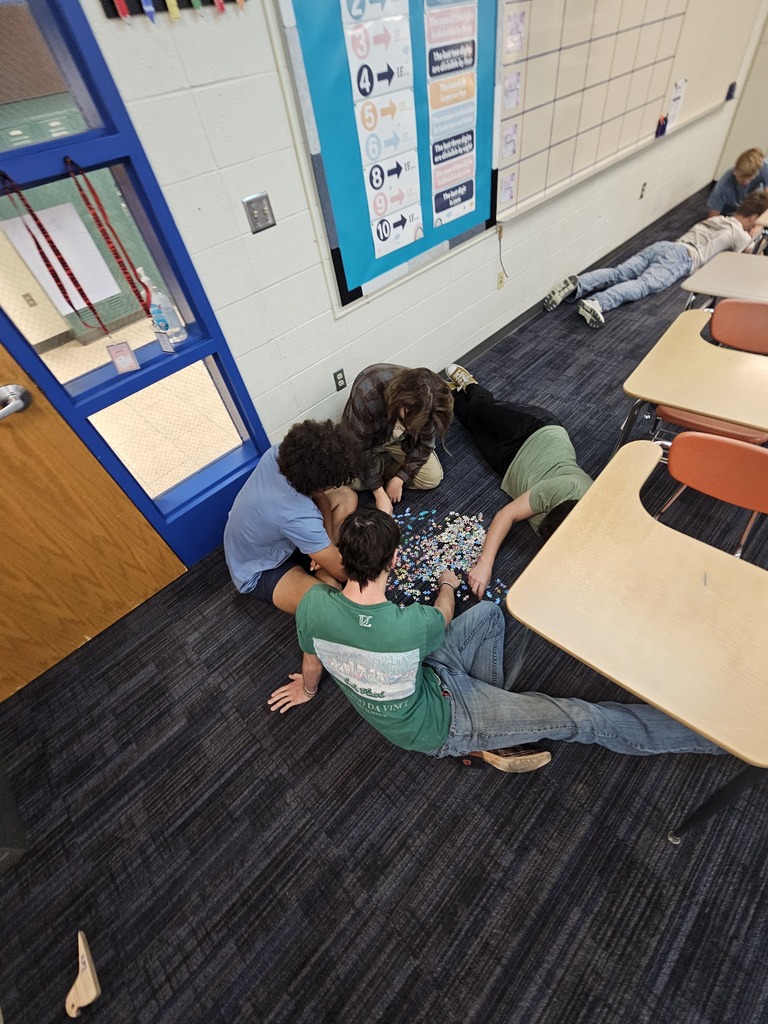 Mrs. Bybee's math classes learn about teamwork by building puzzles in small groups.