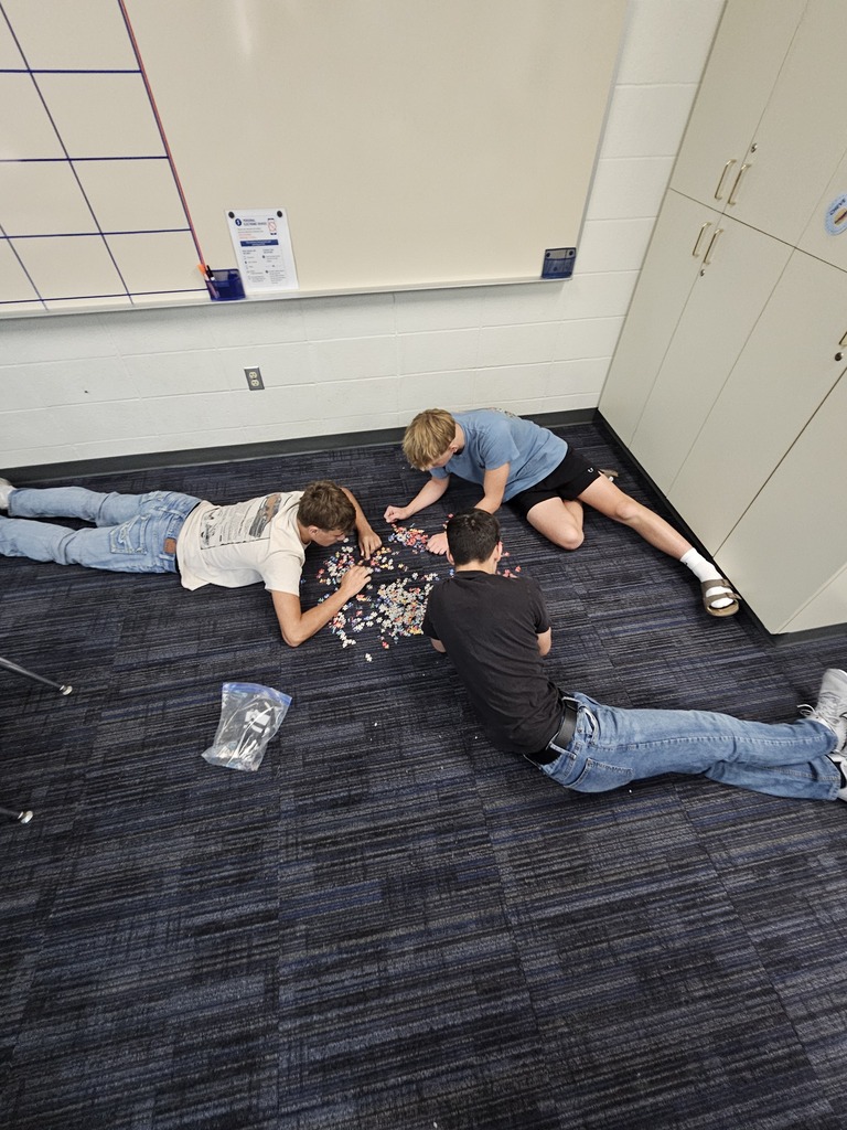 Mrs. Bybee's math classes learn about teamwork by building puzzles in small groups.
