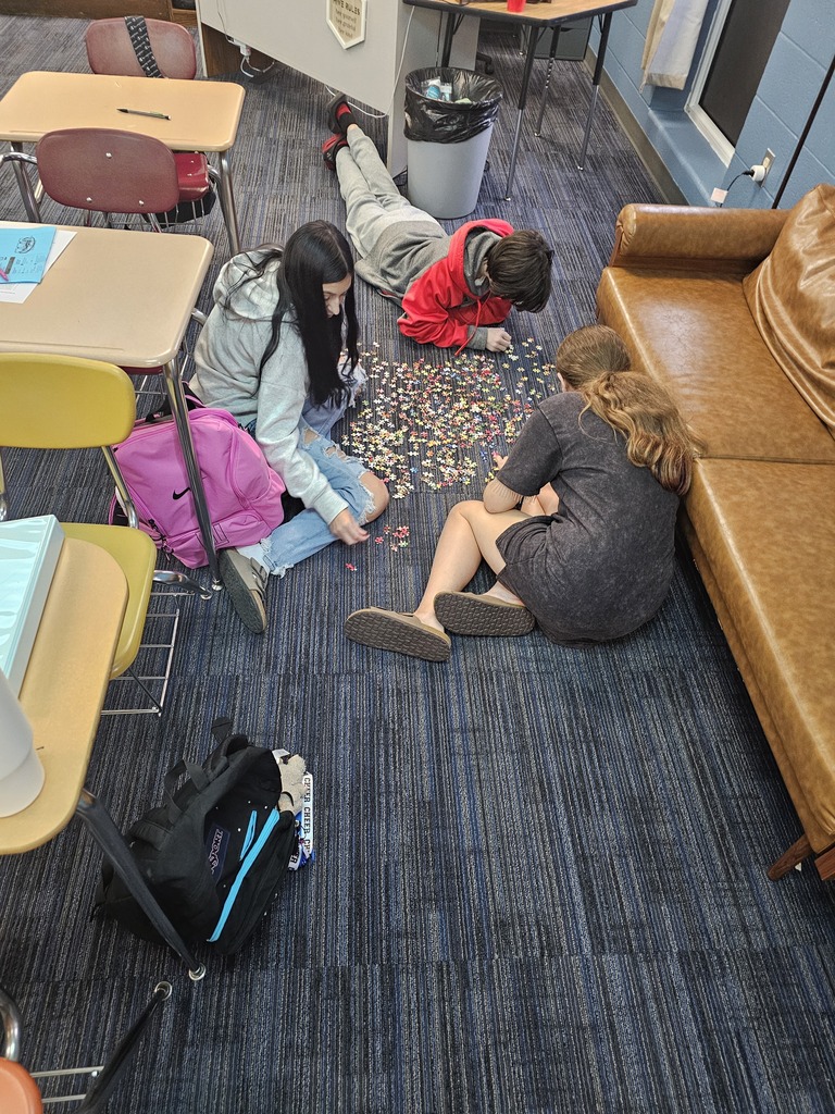 Mrs. Bybee's math classes learn about teamwork by building puzzles in small groups.