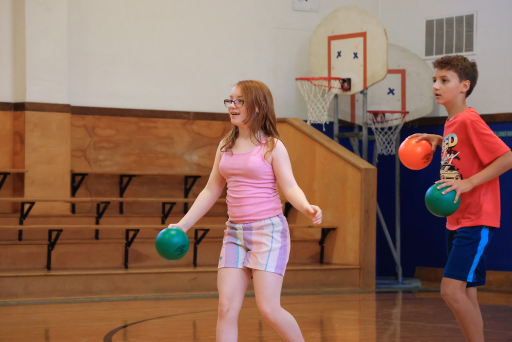 6th graders play dodgeball during Mr. McDonald's P.E. class.
