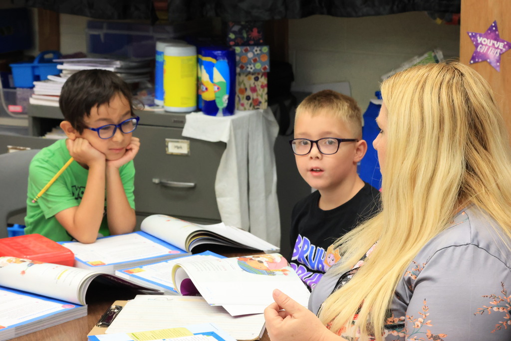 Mrs Trembath works with students on small group reading.