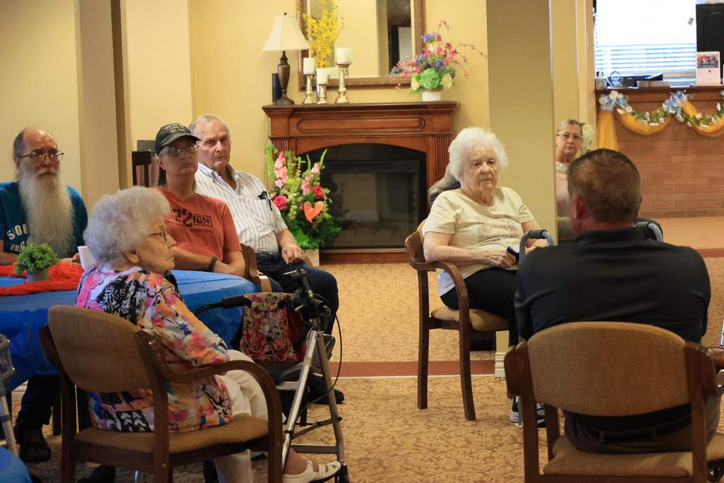 Superintendent Brett Nelson talks with members of the Presbyterian Manor and answers questions about USD 379.