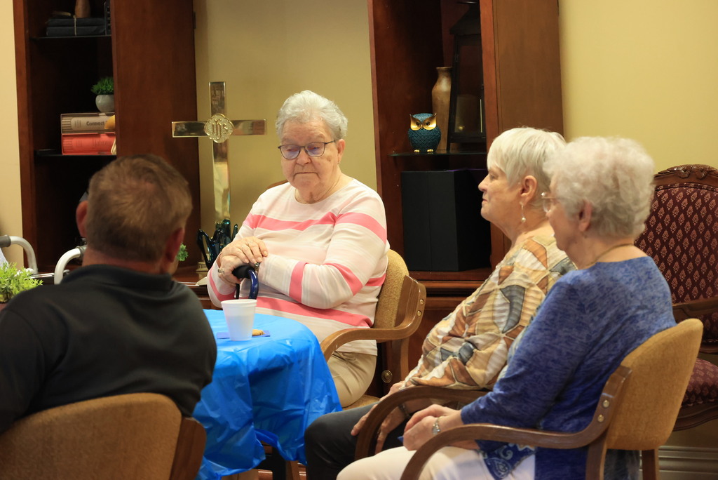 Superintendent Brett Nelson talks with members of the Presbyterian Manor and answers questions about USD 379.