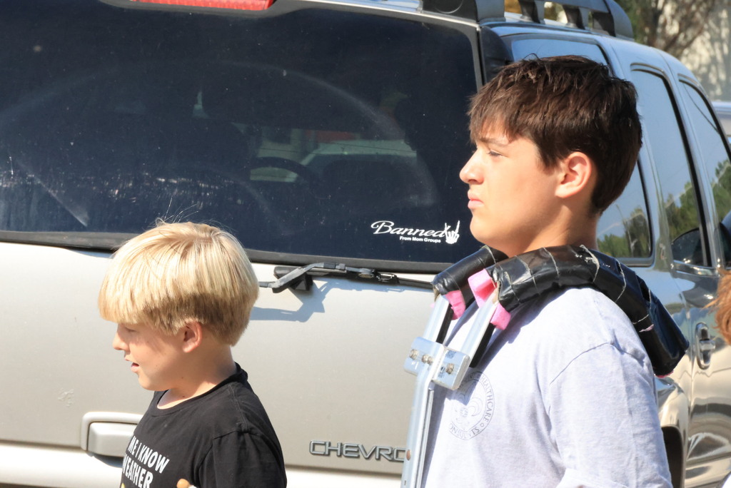 CCCMS 8th graders practice marching and twirling in the parking lot.