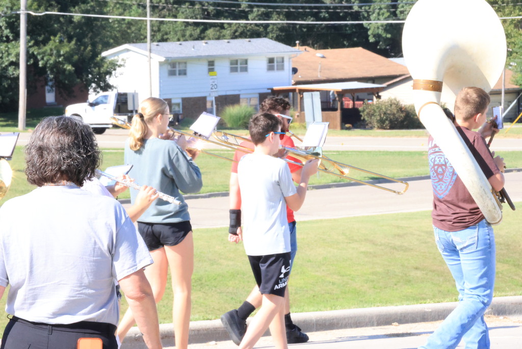 CCCMS 8th graders practice marching and twirling in the parking lot.