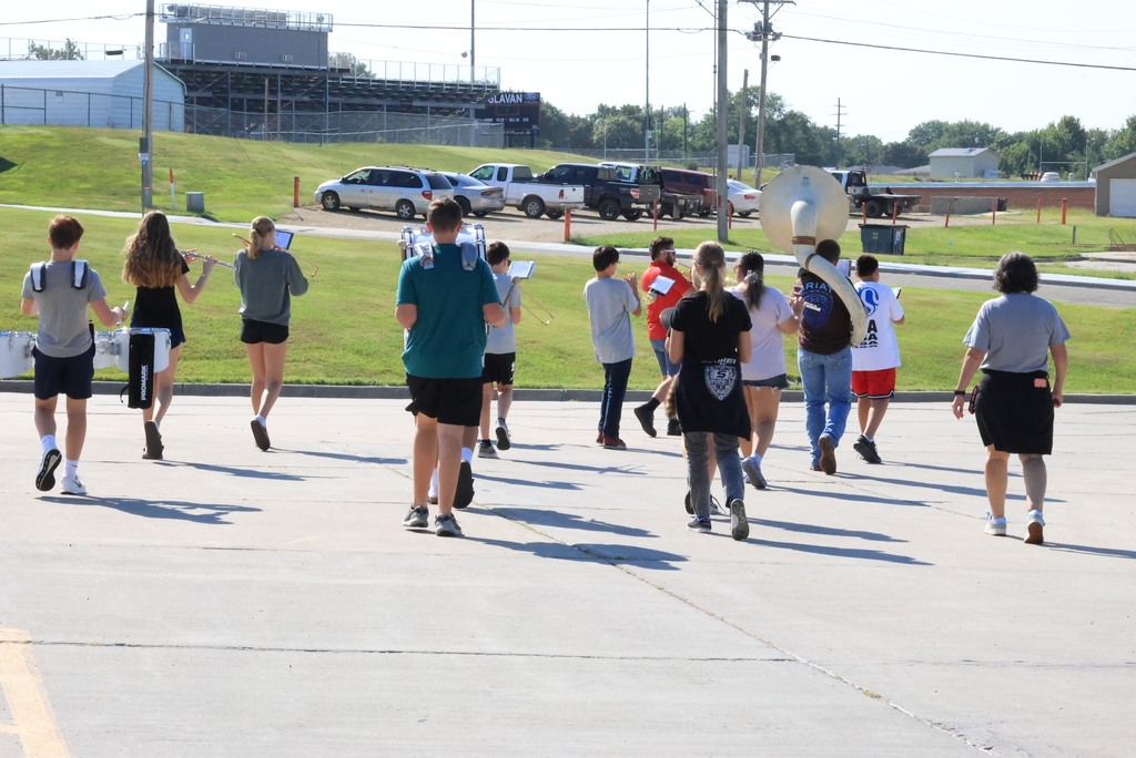 CCCMS 8th graders practice marching and twirling in the parking lot.