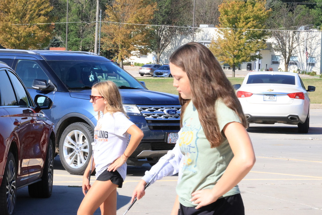 CCCMS 8th graders practice marching and twirling in the parking lot.