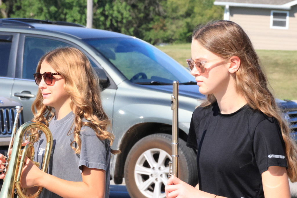 CCCMS 8th graders practice marching and twirling in the parking lot.