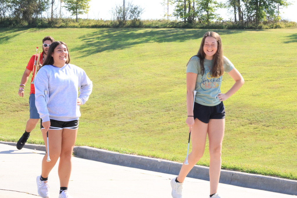 CCCMS 8th graders practice marching and twirling in the parking lot.
