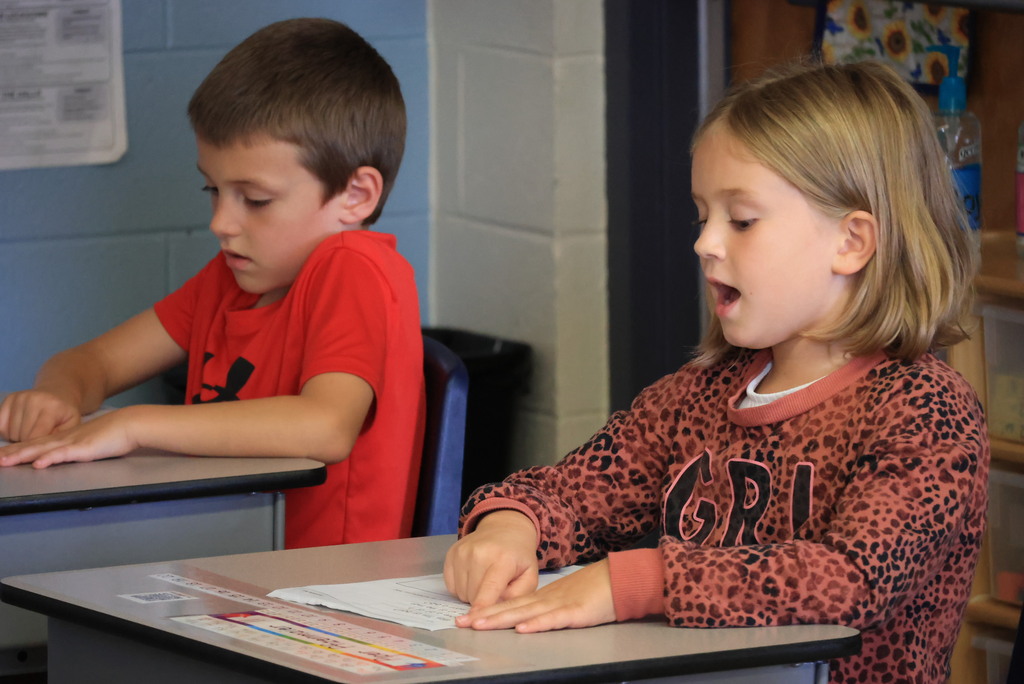 Mrs. Carr's 1st graders read a passage together.