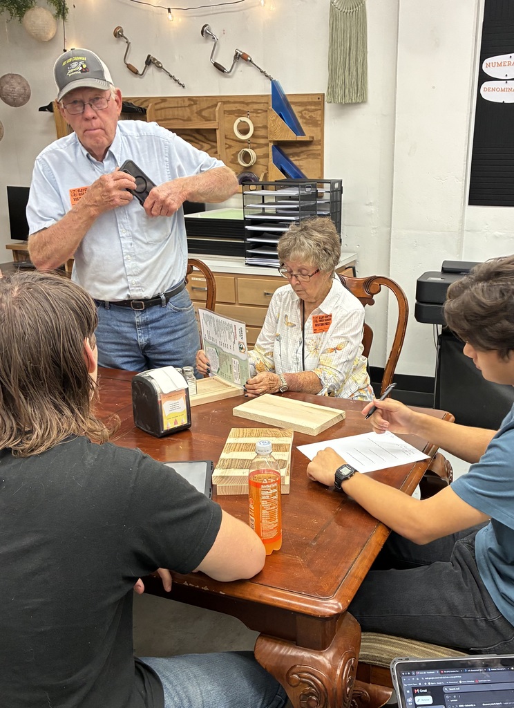 Mrs. Schooley's Cabinetmaking students are working with the Green Cafe to create a holder for their napkins, menus, salt and pepper shakers, and sugar containers. We met with Mr. and Mrs. Lloyd for feedback on our prototype.