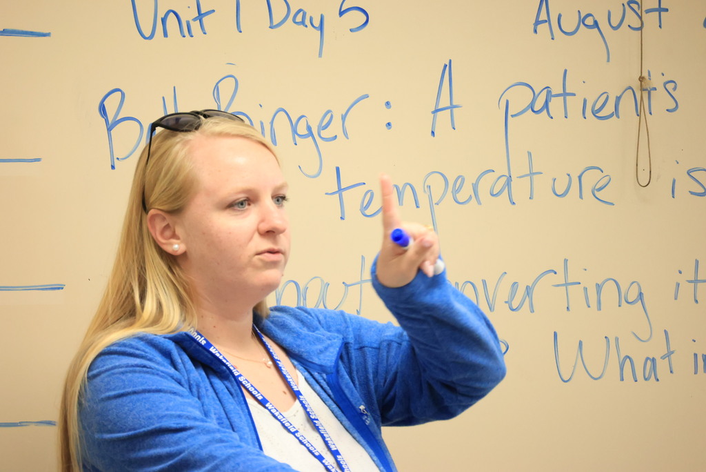 Mrs. Woolever's chemistry students work on a problem converting temperatures from Celcius to Faranheit.