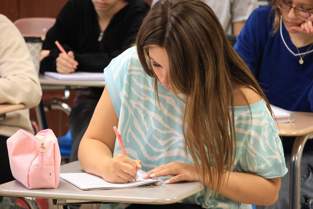 Mrs. Woolever's chemistry students work on a problem converting temperatures from Celcius to Faranheit.