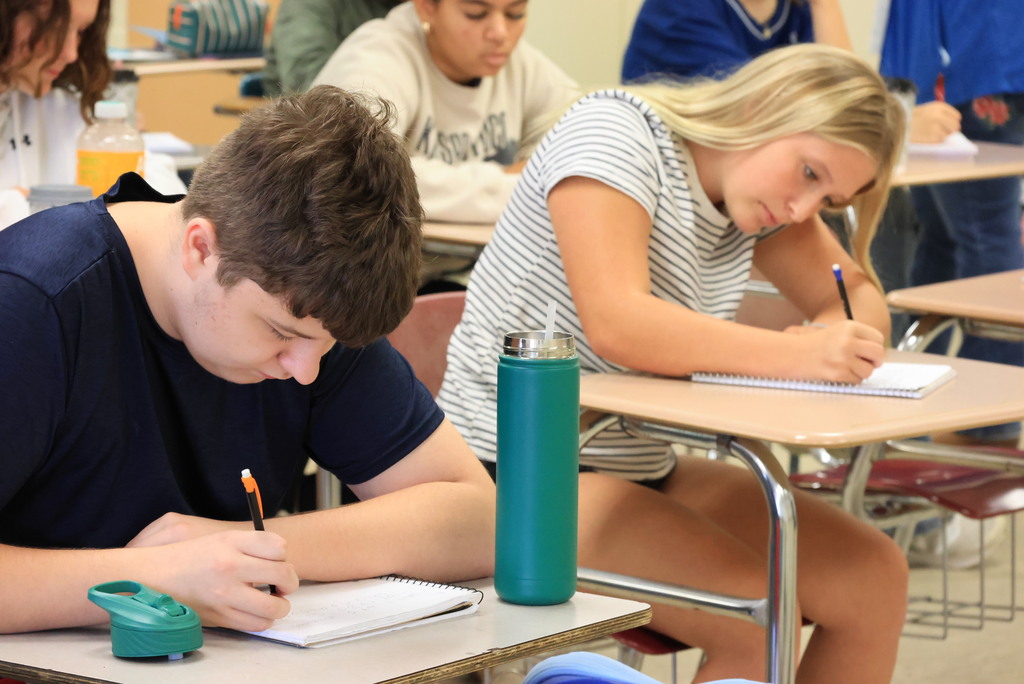 Mrs. Woolever's chemistry students work on a problem converting temperatures from Celcius to Faranheit.