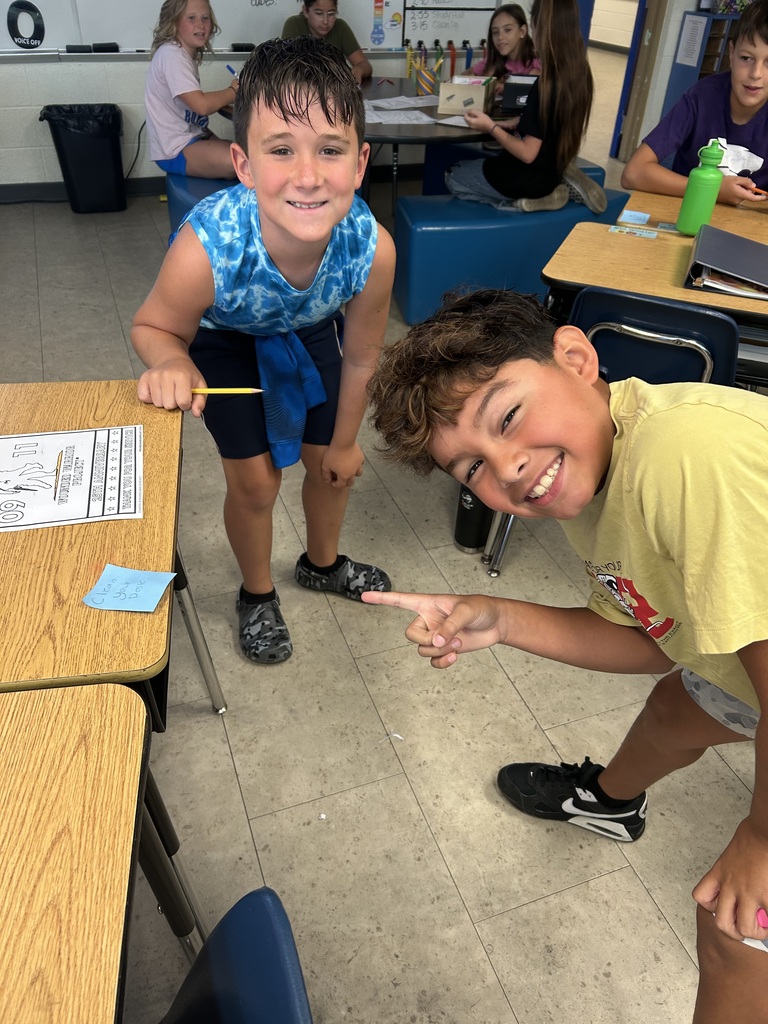 Mr. Yenni's students complete their classroom jobs.