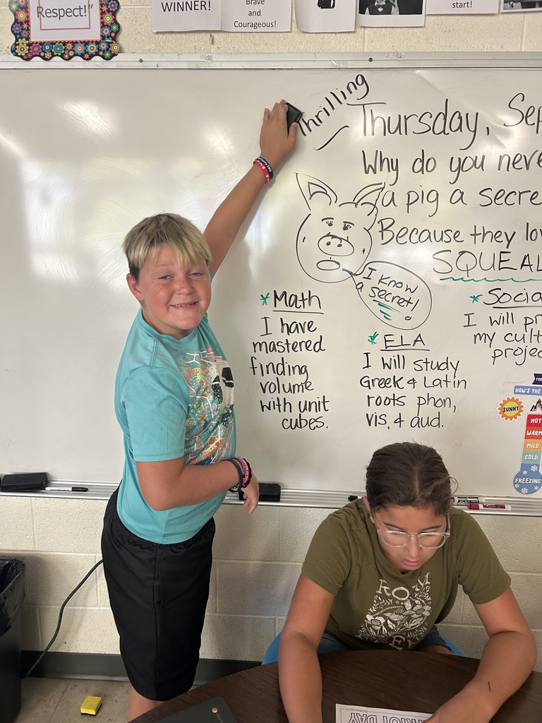 Mr. Yenni's students complete their classroom jobs.