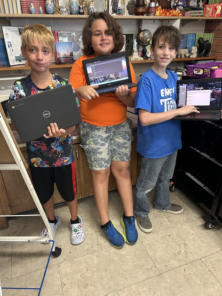 Mr. Yenni's students complete their classroom jobs.